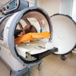Patient receiving Hyperbaric Oxygen Therapy (HBOT) treatment for chronic wound healing and improved circulation at MVS Wound Care & Hyperbaric Medicine